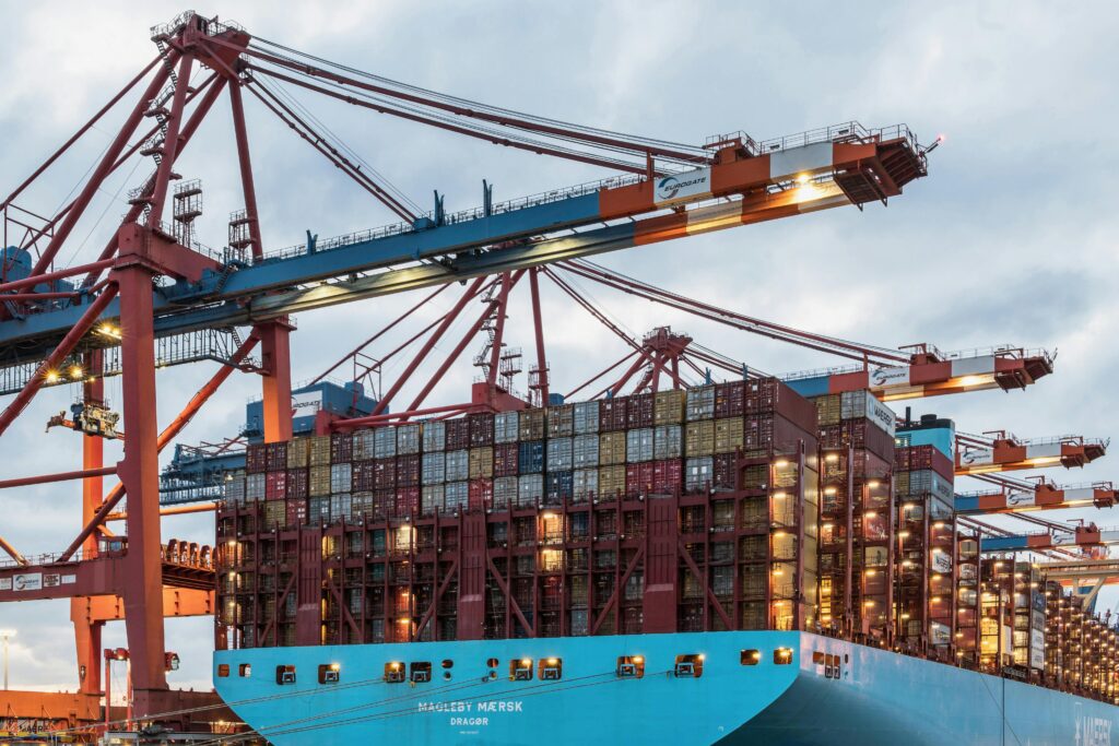 A cargo ship loaded with containers at Hamburg's bustling commercial dock.